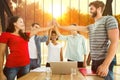 Composite image of happy business team putting their hands together Royalty Free Stock Photo