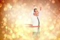 Composite image of happy businessman crossing the finish line and pointing up Royalty Free Stock Photo