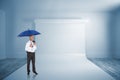 Composite image of happy businessman holding umbrella Royalty Free Stock Photo