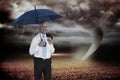 Composite image of happy businessman holding umbrella Royalty Free Stock Photo
