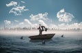 Composite image of happy businessman in a sailboat