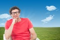 Composite image of happy businessman wearing reading glasses while sitting on chair Royalty Free Stock Photo