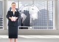 Composite image of happy businesswoman holding a piggy bank Royalty Free Stock Photo