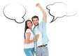 Composite image of happy casual couple cheering at camera Royalty Free Stock Photo