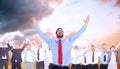 Composite image of happy cheering businessman raising his arms Royalty Free Stock Photo