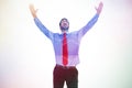 Composite image of happy cheering businessman raising his arms Royalty Free Stock Photo