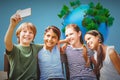 Composite image of happy children taking selfie at park Royalty Free Stock Photo