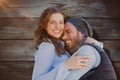 Composite image of happy couple cuddling each other Royalty Free Stock Photo