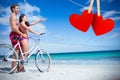 Composite image of happy couple going on a bike ride Royalty Free Stock Photo