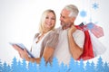 Composite image of happy couple holding shopping bags and looking at tablet pc Royalty Free Stock Photo