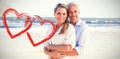 Composite image of happy couple hugging on the beach woman looking at camera Royalty Free Stock Photo