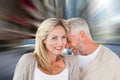 Composite image of happy couple laughing together woman looking at camera Royalty Free Stock Photo