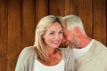 Composite image of happy couple laughing together woman looking at camera Royalty Free Stock Photo