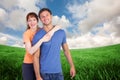 Composite image of happy couple looking at camera Royalty Free Stock Photo