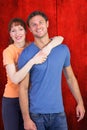 Composite image of happy couple looking at camera Royalty Free Stock Photo