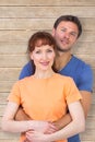 Composite image of happy couple looking at camera Royalty Free Stock Photo