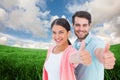 Composite image of happy couple showing thumbs up Royalty Free Stock Photo