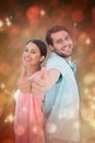 Composite image of happy couple showing thumbs up Royalty Free Stock Photo