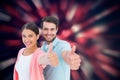 Composite image of happy couple showing thumbs up Royalty Free Stock Photo