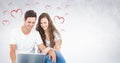 Composite image of happy couple using laptop Royalty Free Stock Photo