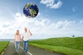 Composite image of happy couple walking holding hands Royalty Free Stock Photo