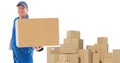 Composite image of happy delivery man showing cardboard box