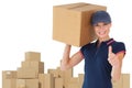 Composite image of happy delivery woman holding cardboard box showing thumbs up Royalty Free Stock Photo