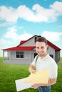 Composite image of happy derivery man giving envelop Royalty Free Stock Photo