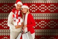 Composite image of happy festive couple with gifts and bags