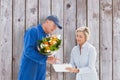 Composite image of happy flower delivery man with customer