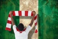 Composite image of happy football fan waving scarf Royalty Free Stock Photo