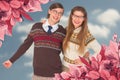 Composite image of happy geeky hipster couple embracing