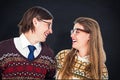 Composite image of happy geeky hipster couple looking at each other Royalty Free Stock Photo