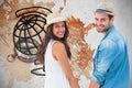 Composite image of happy hipster couple holding hands and smiling at camera Royalty Free Stock Photo