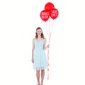 Composite image of happy hipster woman holding balloons