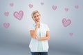 Composite image of happy mature blonde thinking with hand on chin Royalty Free Stock Photo