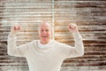 Composite image of happy mature man cheering at camera Royalty Free Stock Photo