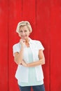 Composite image of happy mature woman smiling at camera Royalty Free Stock Photo