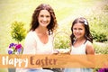 Composite image of happy mother and daughter collecting easter eggs Royalty Free Stock Photo