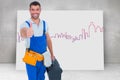 Composite image of happy repairman with toolbox gesturing thumbs up