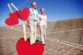 Composite image of happy senior couple walking on the pier Royalty Free Stock Photo