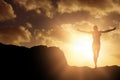 Composite image of happy sportswoman is raising arms