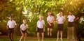 Composite image of happy students in school uniforms Royalty Free Stock Photo