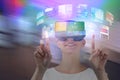 Composite image of happy woman pointing upwards while using virtual reality headset Royalty Free Stock Photo