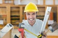 Composite image of happy worker with various equipment Royalty Free Stock Photo