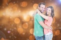Composite image of happy young couple cuddling Royalty Free Stock Photo