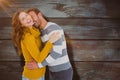 Composite image of happy young couple cuddling Royalty Free Stock Photo