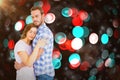 Composite image of happy young couple cuddling each other Royalty Free Stock Photo