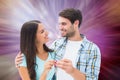 Composite image of happy young couple holding new house key Royalty Free Stock Photo