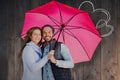 Composite image of happy young couple holding pink umbrella Royalty Free Stock Photo